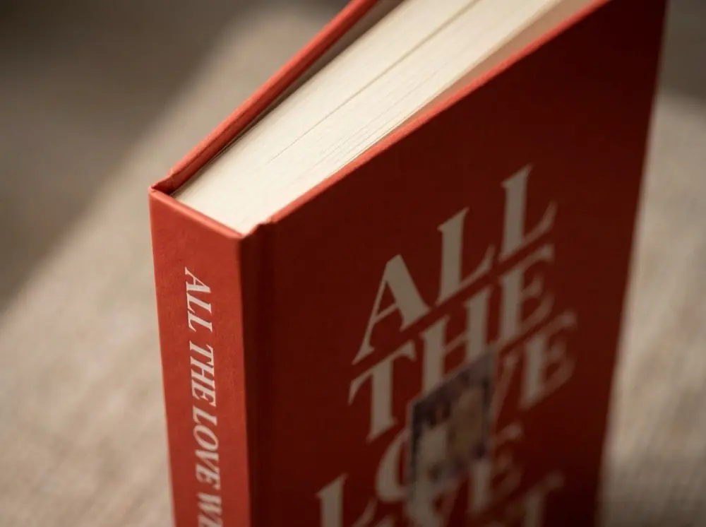 Open Ethos life story hardcover book resting on a table
